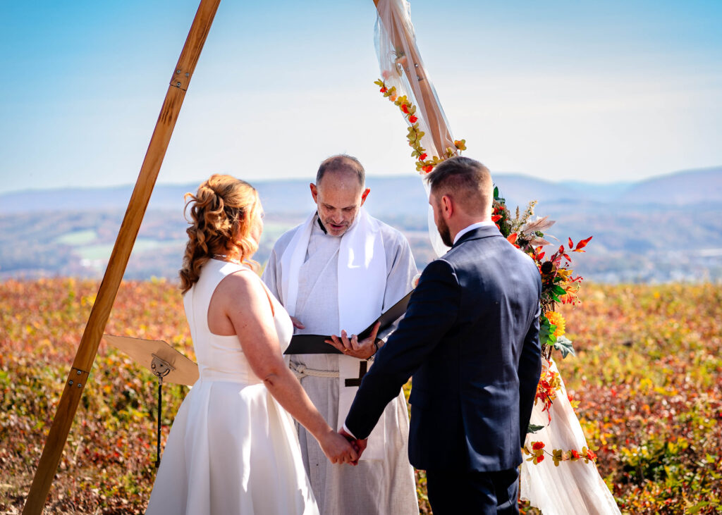 Poconos Elopement Couple with pastor Tom of Poconos Weddings LLC as part of Jim Thorpe Elopements