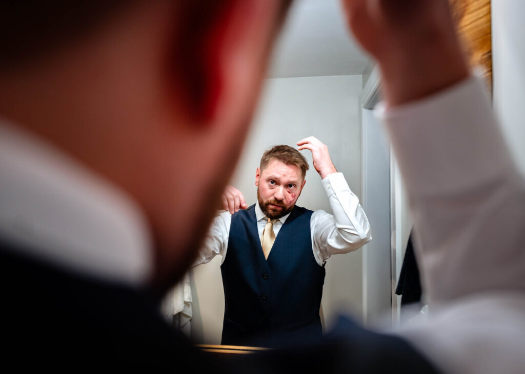 Poconos Elopement Grrom getting ready with Jim Thorpe Elopements